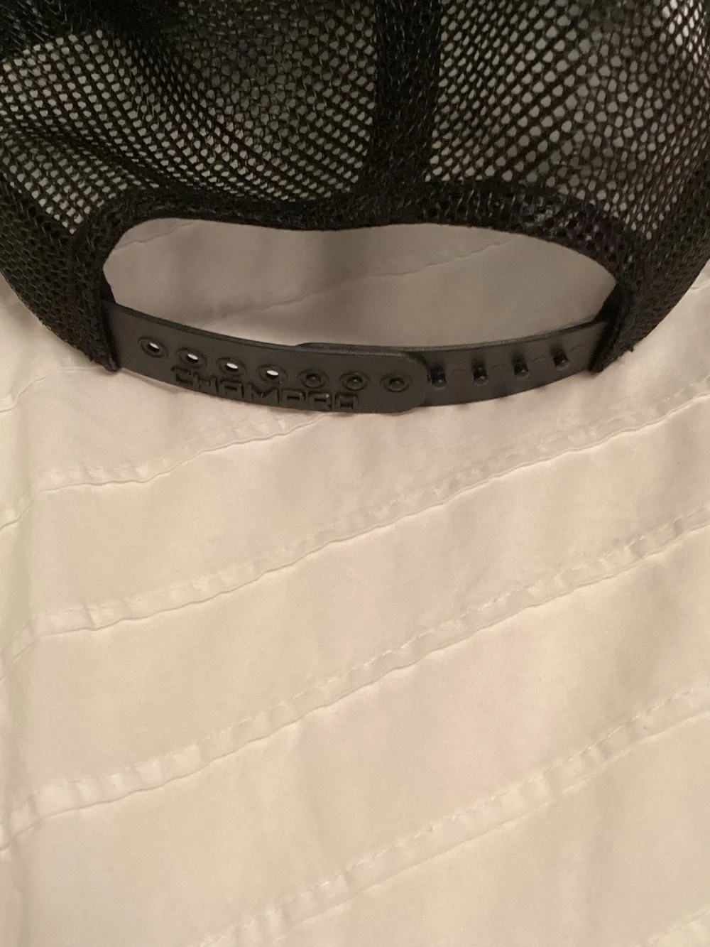 Black Mesh Trucker Cap with White Crossed Letter Accent
